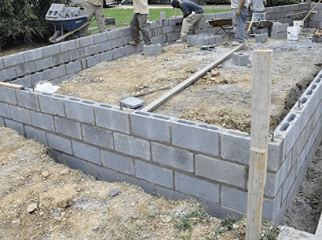 Professionals building a foundation with blocks in Sarasota, FL